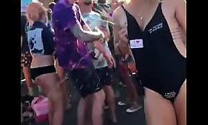 Mom squeezing her milk in crowd dance