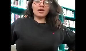 Beautiful College girl with nerd glasses flashing the most perfect tits in her schools library
