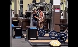 Couple Kissing in Gym