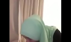 Green Hijabi Blowjob malay girl