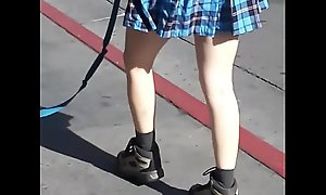 Lolita in skirt walks her dog