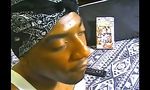 Ebony gangster Brown Eyes amuses himself watching gay porn and  bringing himself off by hand