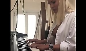 Cleavage Playing Piano