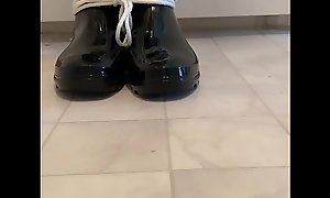 Rubber Boy Squeaks His Boots While Tied Up