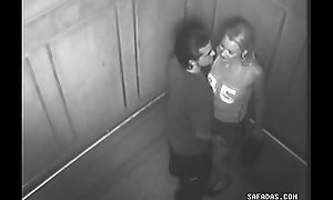 Couple fellow-feeling a amour in elevator forgot involving is a camera