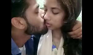Sylheti girl kissing in restaurant