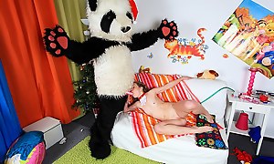 Christmas is the season when you are not supposed to stay alone, and although this blonde sexy girl seems to enjoy herself while decorating the tree and then masturbating she's sent a real Santa Panda to give her Christmas gifts with one of them bei