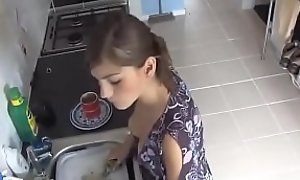 Beauty Exposed in down blouse while doing dishes
