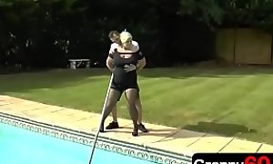 Horny step grandma is watching her sexy young grandson work at pool and all she wants to do is fucked by him