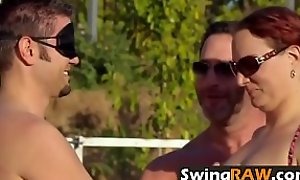 Horny couples are playing wild and sexy games blindfolded in the pool.